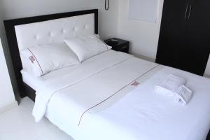 Postel nebo postele na pokoji v ubytování hotel royal fenix
