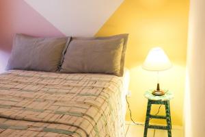 Postel nebo postele na pokoji v ubytování Apartamento aconchegante no Bongi