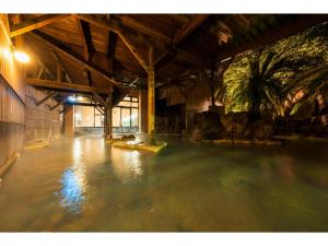 a room filled with water in a building with trees at Oniyama Hotel - Vacation STAY 99621v in Beppu