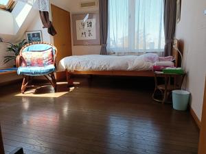 Postel nebo postele na pokoji v ubytování 民泊 B&B yoshida