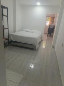 Postel nebo postele na pokoji v ubytování Kayros hostal cks