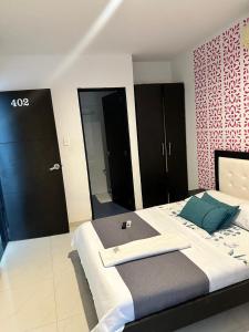 Postel nebo postele na pokoji v ubytování hotel royal fenix
