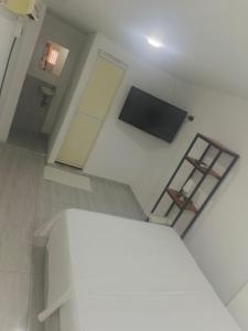 TV a/nebo společenská místnost v ubytování Kayros hostal cks