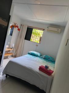 Postel nebo postele na pokoji v ubytování Kayros hostal cks