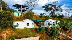 a house on a hill with white domes at Las Terrazas de el Alto in Chalatenango +19 photos
