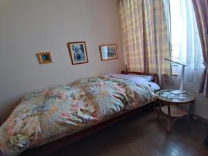 Postel nebo postele na pokoji v ubytování 民泊 B&B yoshida