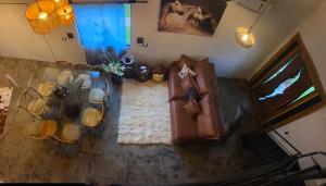 an overhead view of a living room with a couch at Recanto do sossego in Sinop