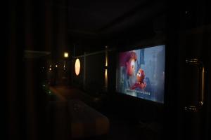 a television screen in a dark room with at The L Boutique Tz in Dar es Salaam