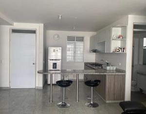 Kuchyň nebo kuchyňský kout v ubytování Apartamento Conjunto Aqualina Orange