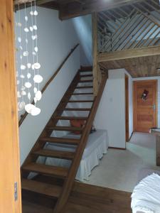 Postel nebo postele na pokoji v ubytování Loft Praia dos Amores Imbituba 5 min da praia