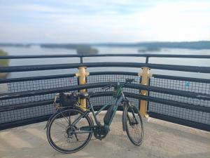 a bike parked next to a fence on a bridge at Reittiö B&B in Sulkava +101 photos