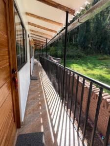 a balcony with a view of a yard at Q'inti Apartment in Lamay