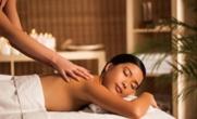 a woman laying on a bed getting a massage at Residence 7 at the Four Seasons Resort in Mae Rim