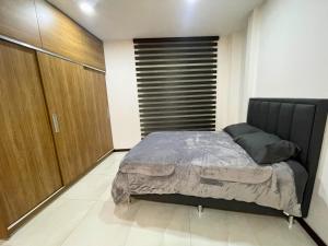 Postel nebo postele na pokoji v ubytování MONOAMBIENTES RESIDENCIALES en TARIJA