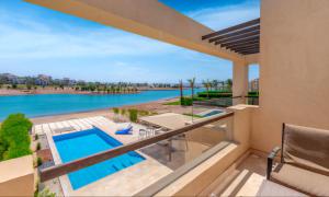 a view of the pool from the balcony of a house at Staylish Villas in Joubal Lagoon El Gouna in Hurghada +59 photos