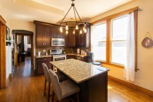 a kitchen with a island with a counter top at Chi-Town Hideout #2 in Berwyn