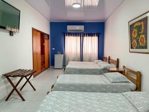 Postel nebo postele na pokoji v ubytování Hotel Veleros Cartagena