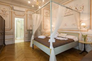 Giường trong phòng chung tại Suites Piazza Del Popolo
