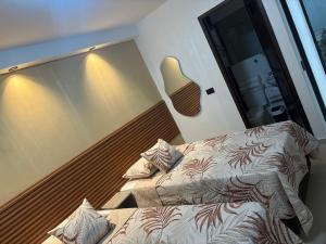 Postel nebo postele na pokoji v ubytování Hotel Lesus