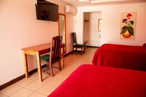 TV a/nebo společenská místnost v ubytování Hotel Doña Crucita