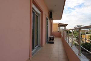a balcony of a building with a view at Vila Eni - Mario in Ksamil