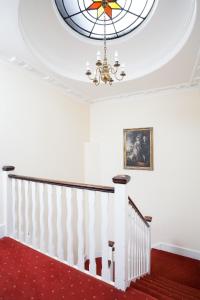 a large red and white staircase leading to a balcony at The Angel Posting House & Livery in Guildford