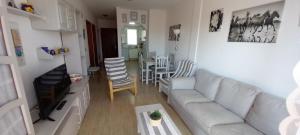 a living room with a couch and a table at Casa Karina in Parque Holandes