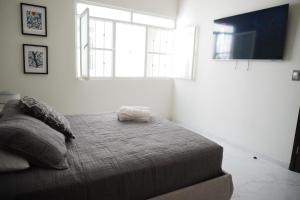 Postel nebo postele na pokoji v ubytování Departamento Vintage + 24 fotografií