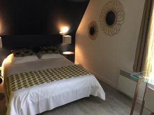 Postel nebo postele na pokoji v ubytování Hôtel-Restaurant Le Flobart