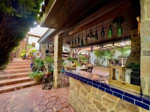 a restaurant with a counter and a table and chairs at Villa Tortuga 2 BR 2 BA in Playas de Tijuana in Tijuana