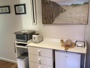 Kuchyň nebo kuchyňský kout v ubytování Millie's Apartment