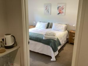 Postel nebo postele na pokoji v ubytování Millie's Apartment