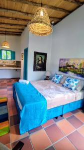 En eller flere senge i et værelse på Hotel Boutique Campestre El Ensueño