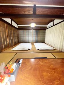 Postelja oz. postelje v sobi nastanitve 天海 Tenkai 丸々貸切1日1組限定宇野駅から宿まで5分無料送迎有り