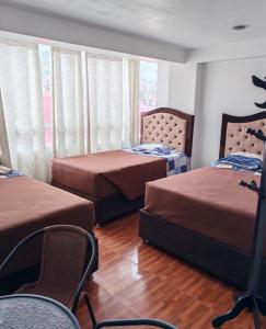 En eller flere senge i et værelse på Las Margaritas Apart Rent