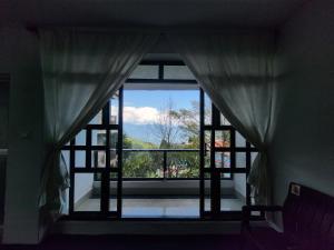 a window in a room with a view at Jetsunma Homestay in Darjeeling