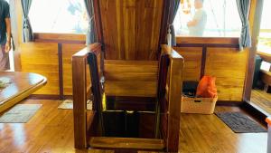 a wooden cabin with an open door on a boat at Gallia Phinisi Batam in Nagoya