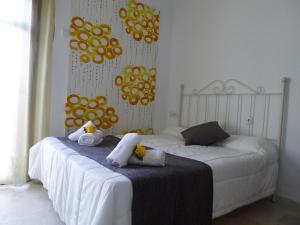 Postel nebo postele na pokoji v ubytování Hostel Conil