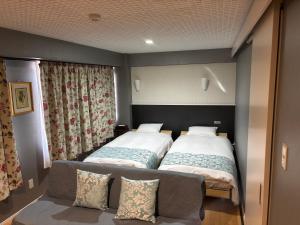 Postel nebo postele na pokoji v ubytování Town Hotel 41