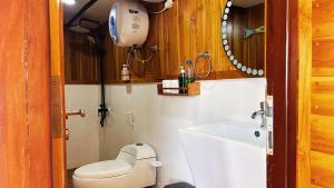 a small bathroom with a toilet and a sink at Gallia Phinisi Batam in Nagoya +30 photos