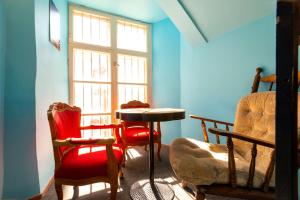 a room with chairs and a table and a window at 16eur - Old Town Munkenhof in Tallinn