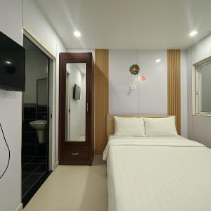 Postel nebo postele na pokoji v ubytování LAM ANH Hotel