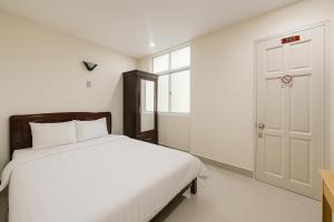 Postel nebo postele na pokoji v ubytování LAM ANH Hotel