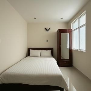 Postel nebo postele na pokoji v ubytování LAM ANH Hotel