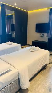 Ariya Nivaas A Vegetarian Hotel客房内的一张或多张床位