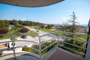 a balcony with a view of a street at Guesthouse Villa Lena in Premantura