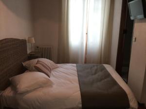 Postel nebo postele na pokoji v ubytování Ma Petite Auberge