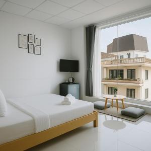 Postel nebo postele na pokoji v ubytování LAM ANH Hotel