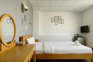 Postel nebo postele na pokoji v ubytování LAM ANH Hotel