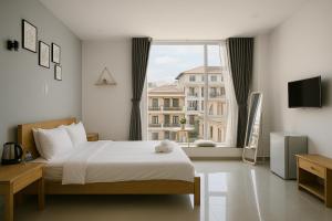 Postel nebo postele na pokoji v ubytování LAM ANH Hotel
